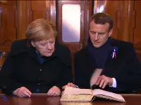 Macron and Merkel in rail car